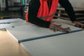 A worker prepares PVC furniture boards for packaging