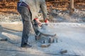 A worker prepares a sidewalk for paving a footpath. Royalty Free Stock Photo