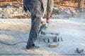 A worker prepares a sidewalk for paving a footpath. Royalty Free Stock Photo