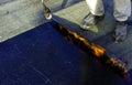 Worker preparing part of bitumen roofing felt roll Royalty Free Stock Photo