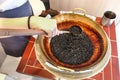 Worker preparing tapioca pearl balls to be made bubble tea