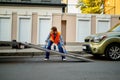 Worker preparing tow truck platform for car