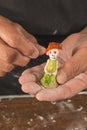 Worker preparing typical Mexican sweets made from AlfeÃÂ±ique, used during the Dia de Muertos festival to put on altars.