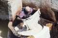 Worker Processing Hides In a White Tanning Pool At A Traditional