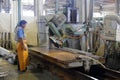 Worker processing stone material in workroom Royalty Free Stock Photo