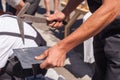 Worker produces roofing slate using a slate hammer. Royalty Free Stock Photo