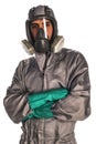 Production worker in protective overalls, mask and gloves