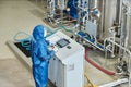 Worker in protective gear standing by control panel Royalty Free Stock Photo