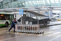 A worker pushes Luggage carts at Moscow`s Sheremetyevo international airport