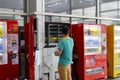 Worker put drinks in the vending machine