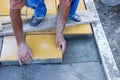 Worker puts concrete pavers 3 Royalty Free Stock Photo