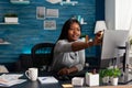 Worker putting sticky notes on monitor doing remote work Royalty Free Stock Photo