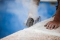 Worker with radial saw with dust on the air with blue background