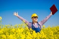 Worker in a rapeseed field doing inspection for biodiesel production Royalty Free Stock Photo