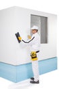 Worker rasping insulation panels Royalty Free Stock Photo