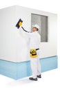 Worker rasping insulation panels Royalty Free Stock Photo