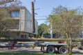 Worker Receiving Damaged Utility Pole in Uptown New Orleans