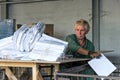 Recycling factory worker at work sorting garbage