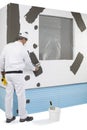 Worker reinforcing a window frame