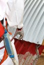 Worker during the remediation of asbestos from the roof