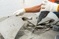 Worker remove, demolish old tiles a bathroom Royalty Free Stock Photo