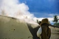 Worker is remove paint by air pressure sand blasting Royalty Free Stock Photo