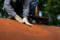 Worker is remove paint by sand paper Royalty Free Stock Photo