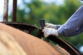 Worker is remove paint by sand paper Royalty Free Stock Photo