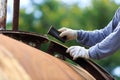 Worker is remove paint by sand paper Royalty Free Stock Photo