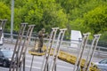 A worker removes old paint from road barriers