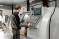 Worker removes the part from CNC lathe machine. Turning machine for drilling with the drill tool and center drill tool .The hi-