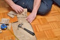 Worker Removing Damaged Parquet