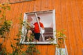 Worker removing old window in flat. Replacement of window frames. Royalty Free Stock Photo