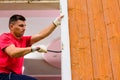 Worker removing old window in flat. Replacement of window frames Royalty Free Stock Photo