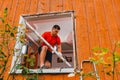 Worker removing old window in flat. Replacement of window frames Royalty Free Stock Photo