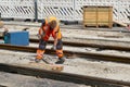 A worker renewing old tracks of the tramway in Berlin