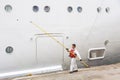 Worker renovate the ship`s side