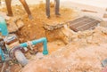 Worker repair pipe plumbing water main broken. Use shovel to dig a hole underground on the road