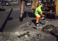 Worker repairing a road hammer crowbar