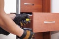 Worker repairs furniture