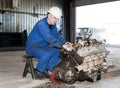 Worker repairs a motor
