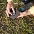 The worker replaces the grinding stone in the angle grinder