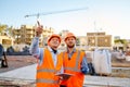 Worker reporting to contractor at construction site Royalty Free Stock Photo