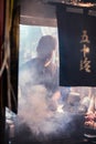 Worker of the restaurant preparing the food for the customer at traditional bar in Omoide Yokocho, Shinjuku. Portrait Orientation
