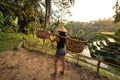 Worker on rice field carrying around. Agricultural details on rice terraces Royalty Free Stock Photo