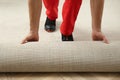 Worker rolling out new carpet flooring Royalty Free Stock Photo