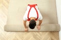 Worker rolling out new carpet flooring indoors, top view Royalty Free Stock Photo