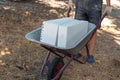 Worker rolls a cart with foam concrete blocks. Construction and reconstruction of houses and premises