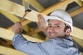worker roofer builder working on roof structure on construction site Royalty Free Stock Photo