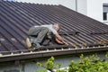 Worker roofer builder working on roof structure